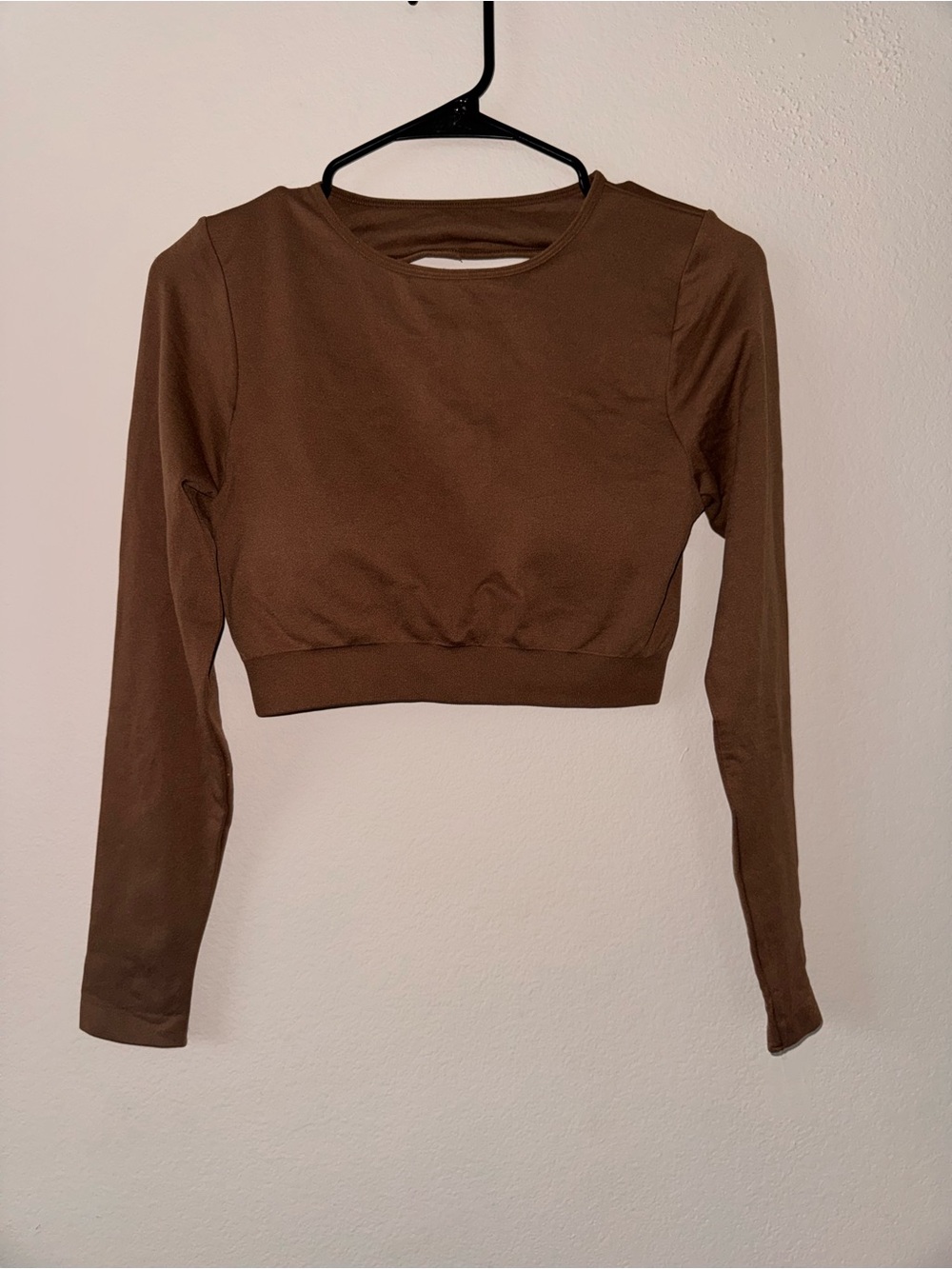 NVGTN Journey Long Sleeve Seamless Bra Top in the color brown. Size Medium